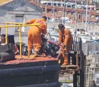 Workers raised by forklift truck